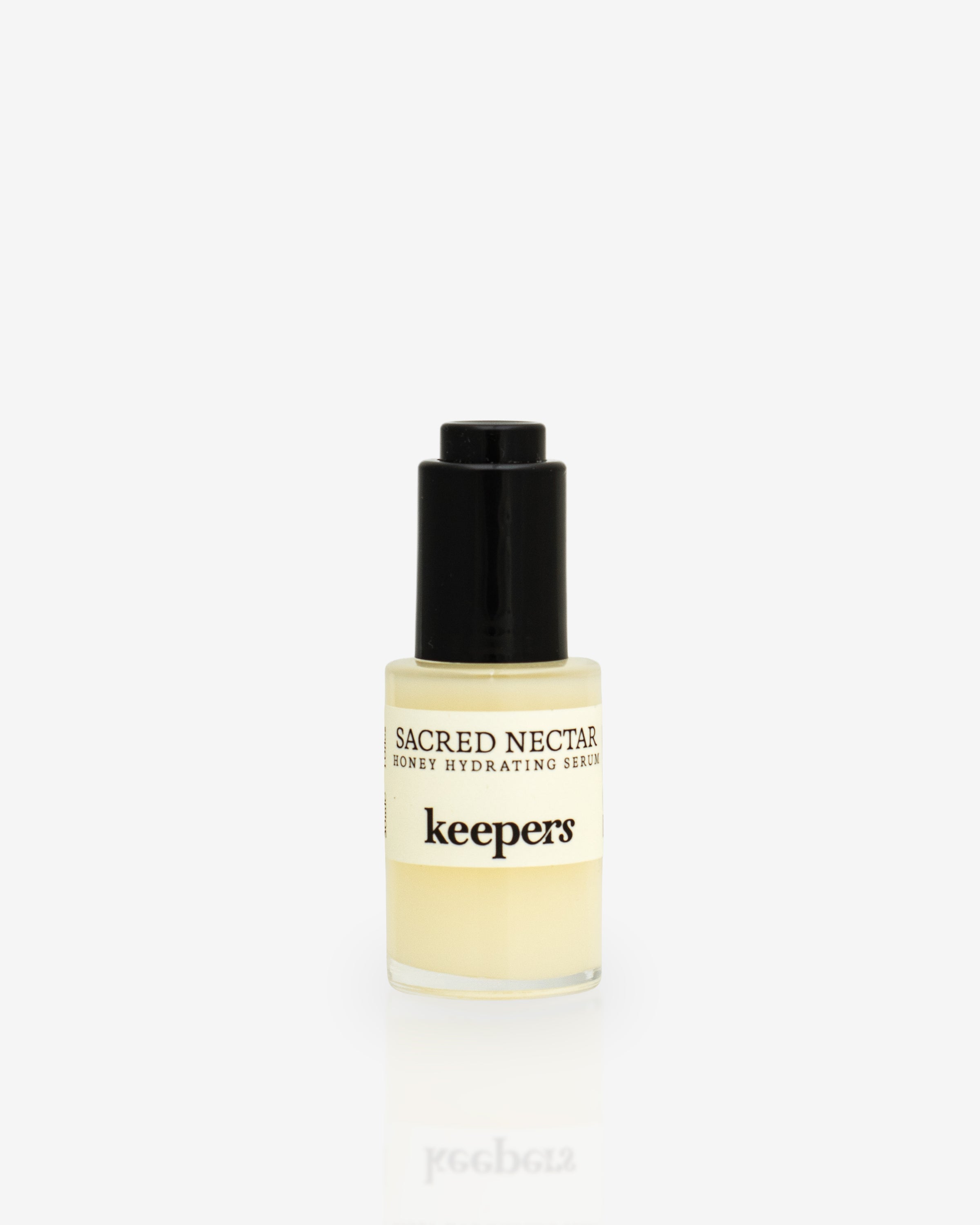 Sacred Nectar hydrating serum bottle on white background
