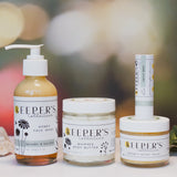 Collection of Keeper's Collective skincare products on a blurred background